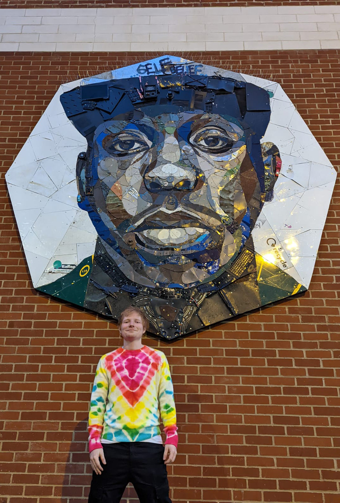 Ed Sheeran in front of Jamal Edwards mural by Matt Small